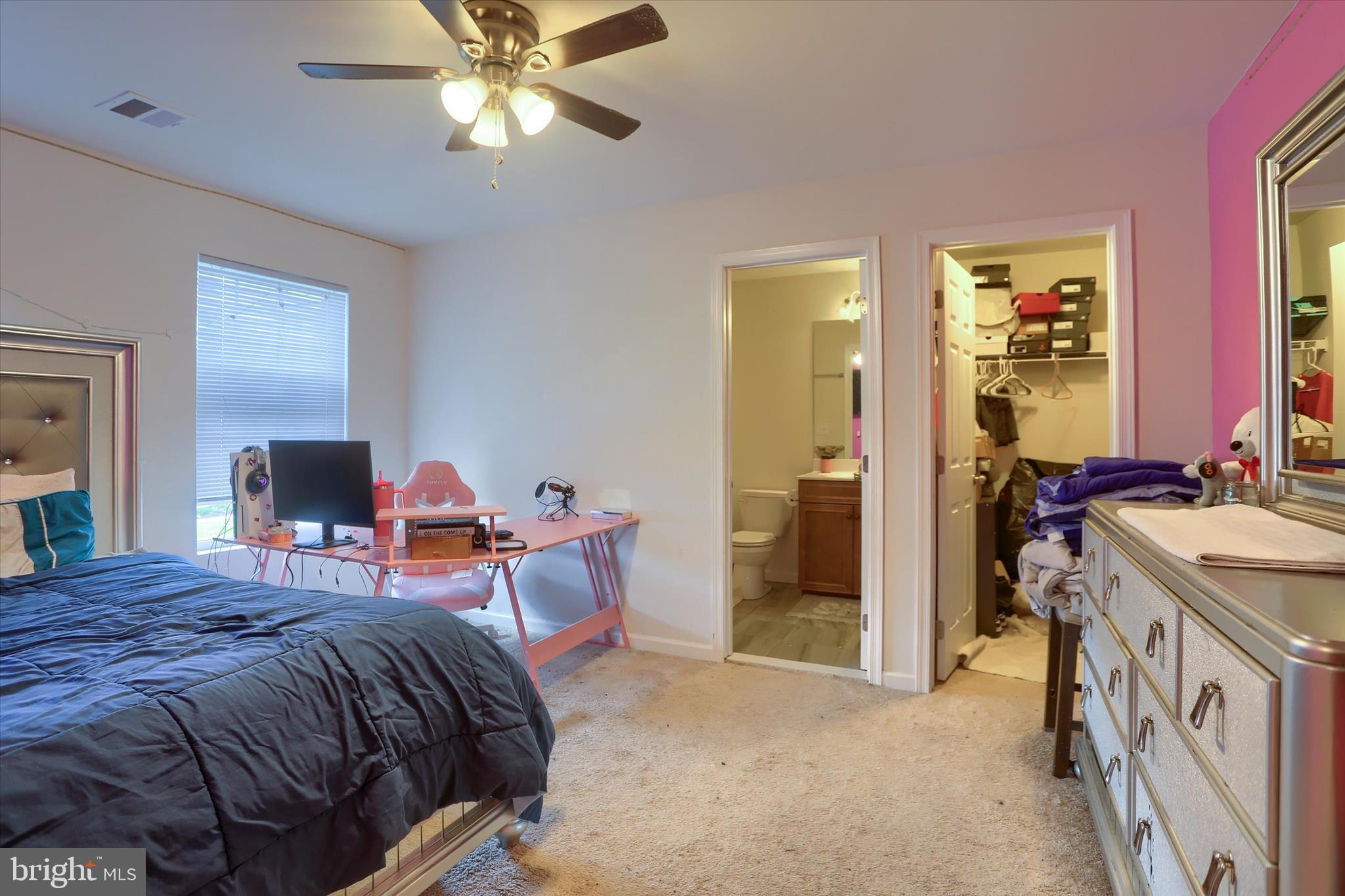 515 Darrow Road York, PA 17404 - Photo 31 of 41 a bedroom with a bed and a chandelier