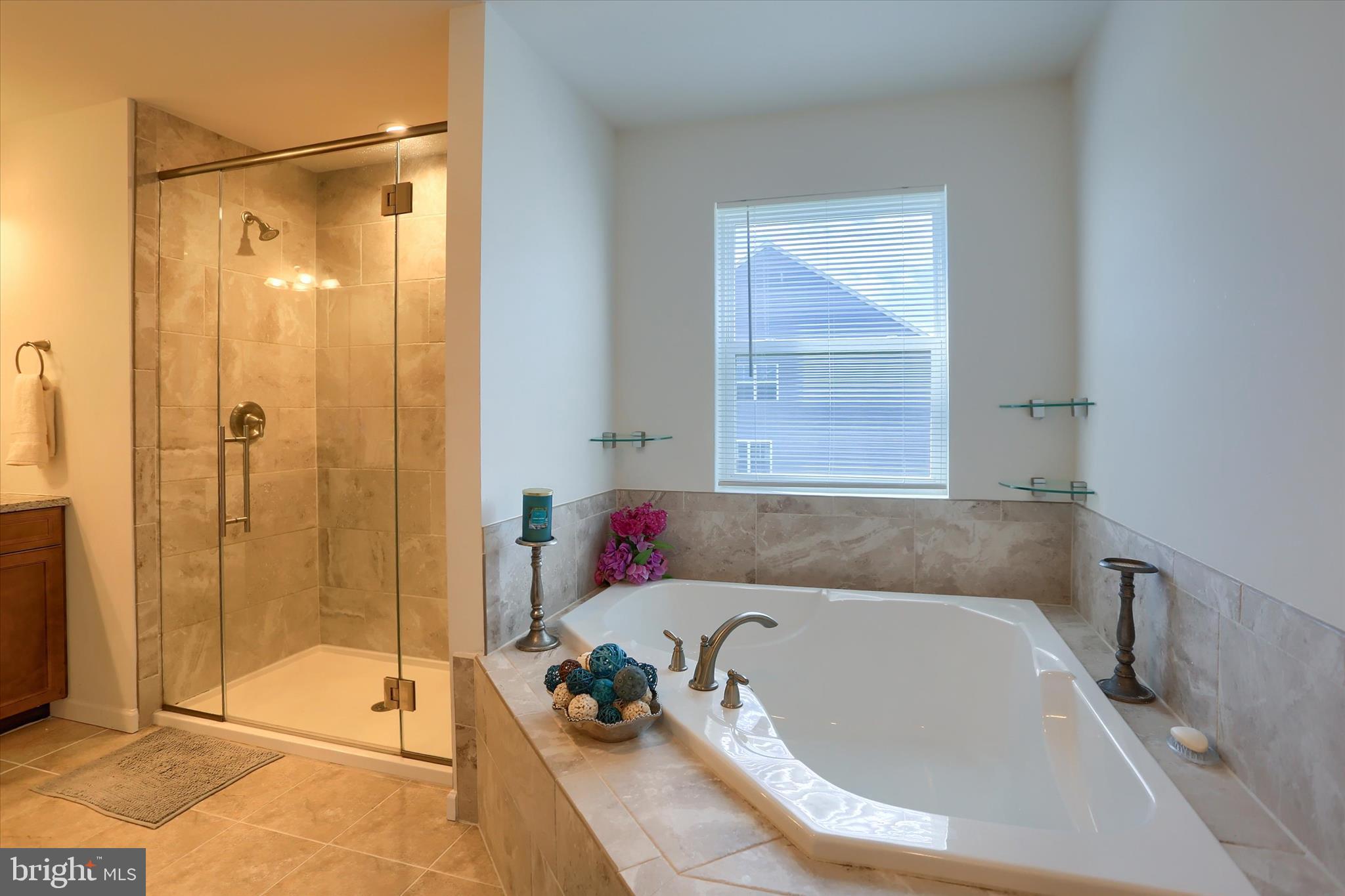 515 Darrow Road York, PA 17404 - Photo 4 of 41 a bathroom with a tub a window and a shower