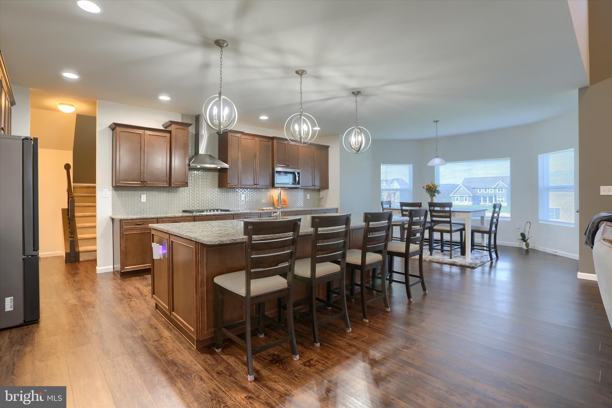515 Darrow Road York, PA 17404 - Photo 7 of 41 a large kitchen with a table and chairs