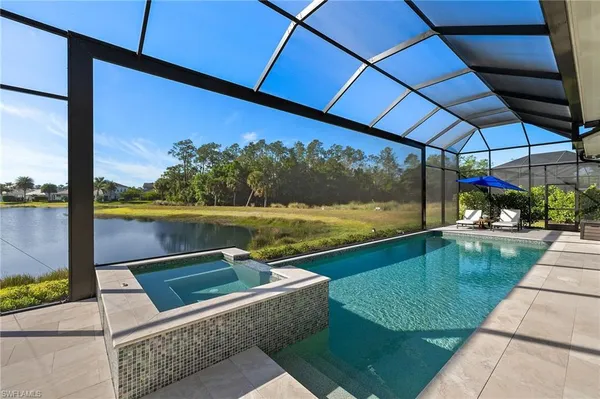 a view of swimming pool with a patio
