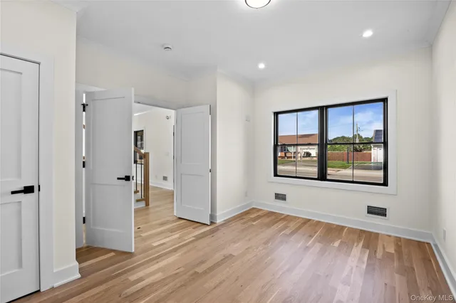 a large kitchen with kitchen island a large counter space a sink and stainless steel appliances