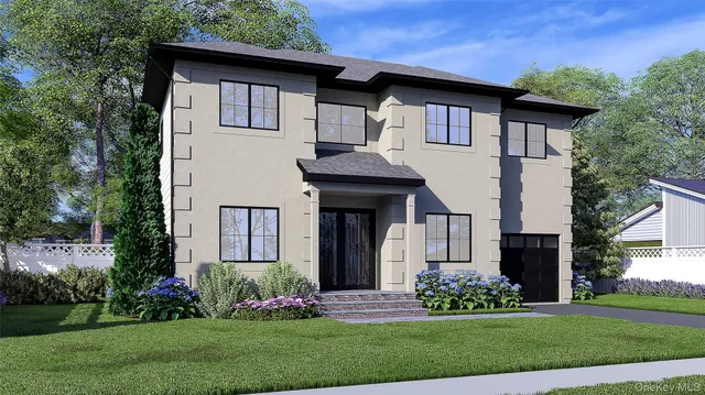 a front view of a house with a yard and potted plants