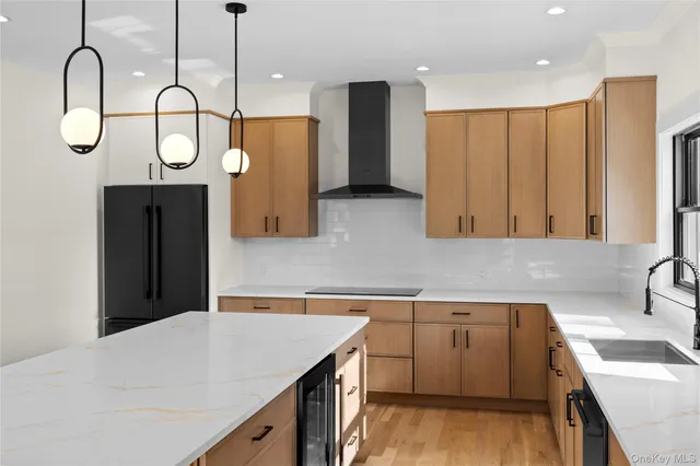 a kitchen with a sink and a refrigerator