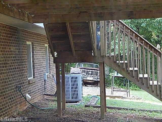 4036 Flat Shoals Road Germanton, NC 27019 - Photo 15 of 16 Patio/Deck. Storage space under deck.