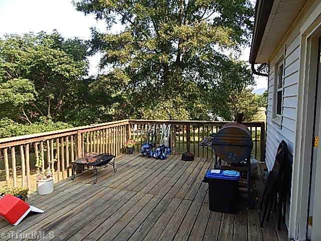 4036 Flat Shoals Road Germanton, NC 27019 - Photo 16 of 16 Patio/Deck. Huge deck on back overlooking backyard.