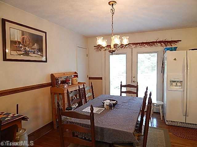 4036 Flat Shoals Road Germanton, NC 27019 - Photo 5 of 16 Dining Room. Dining area has wood floor and pantry.
