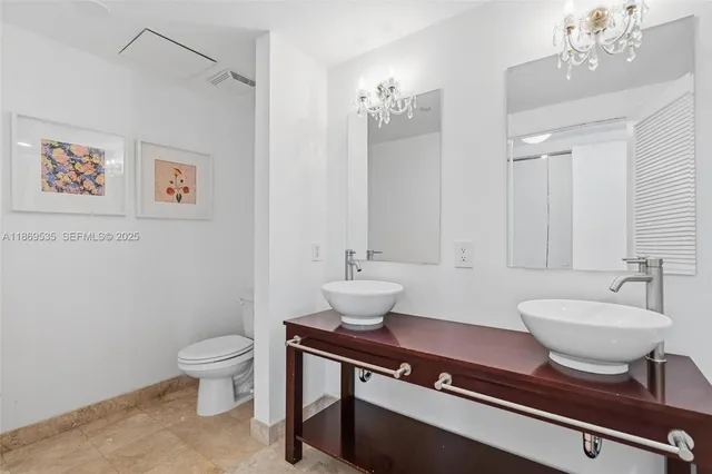 a dining room with furniture and a window