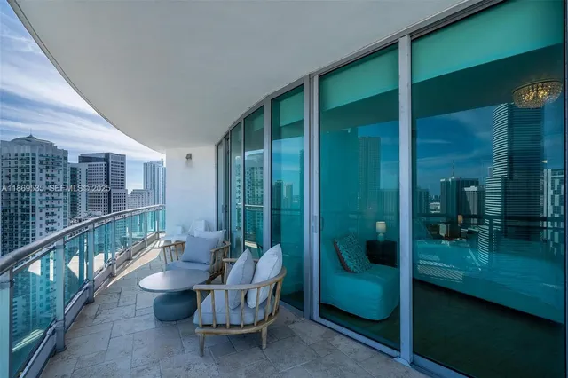 a view of a livingroom with furniture and windows