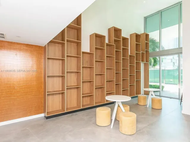 a swimming pool with outdoor seating and yard