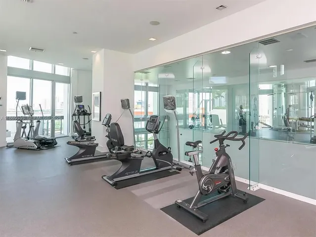 a swimming pool with outdoor seating and yard