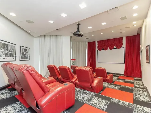 a view of a swimming pool with outdoor seating