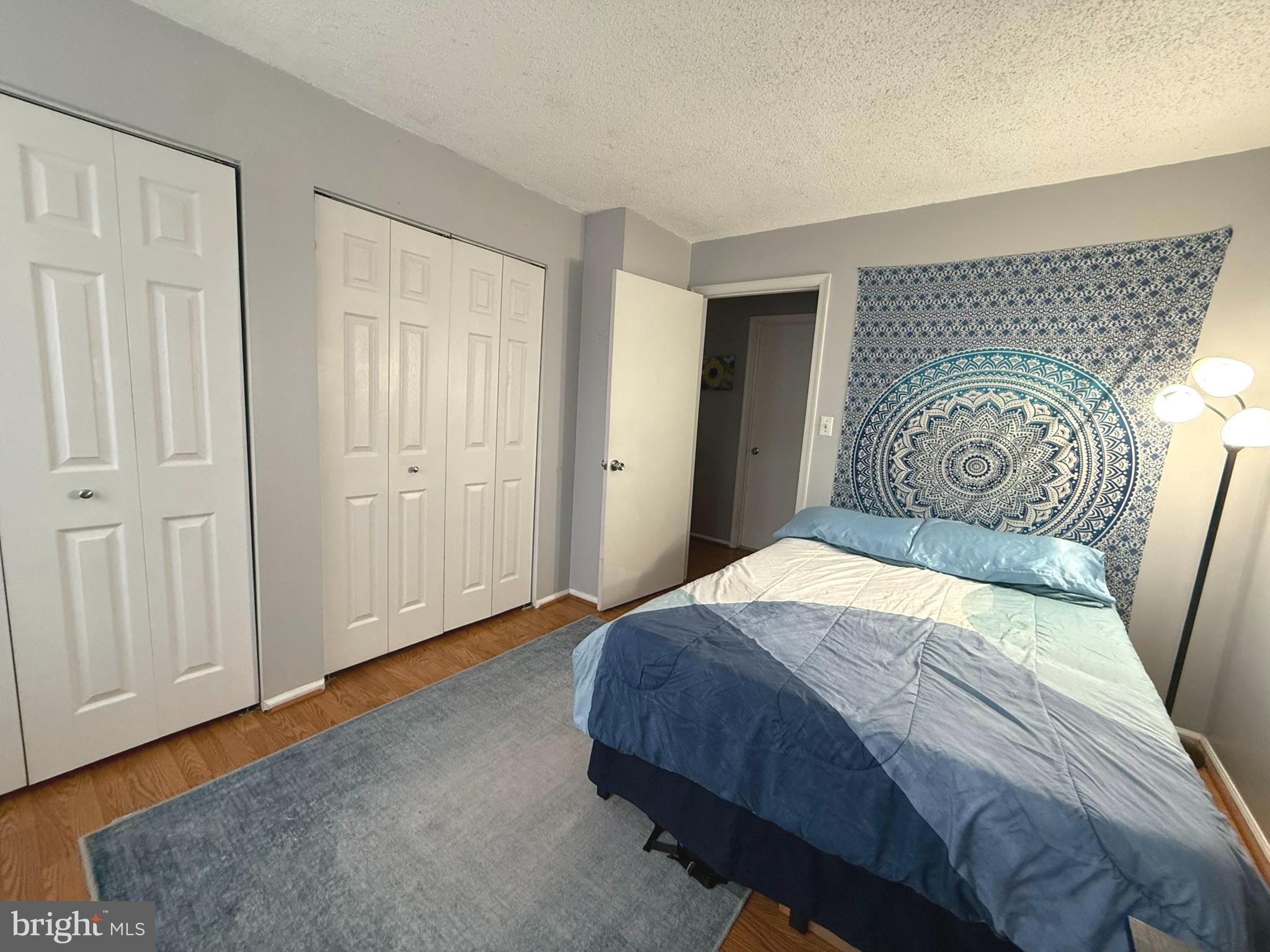 12 Juniper Way Hamilton, NJ 08619 - Photo 11 of 18 a bedroom with a bed and a painting on the wall