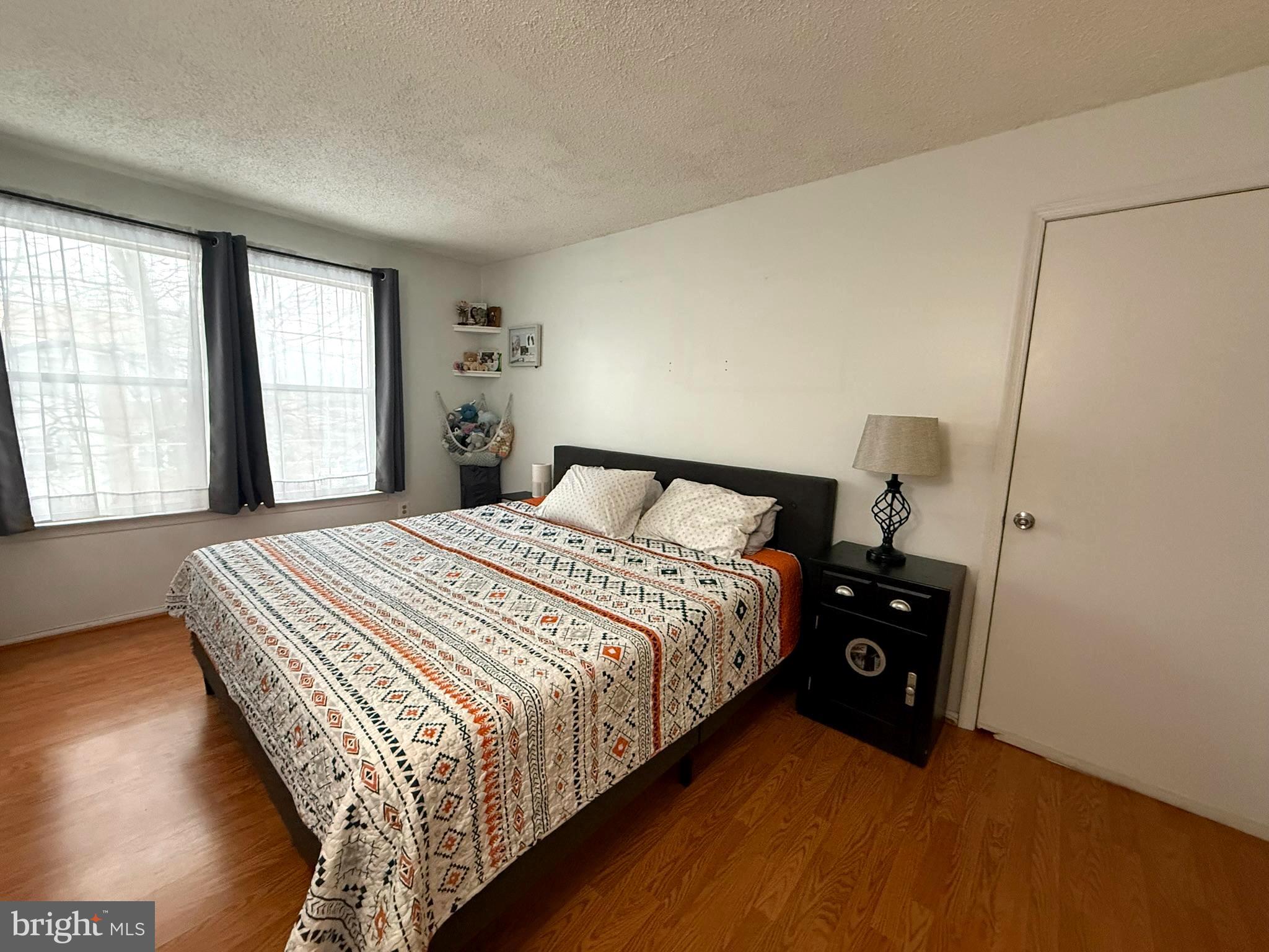 12 Juniper Way Hamilton, NJ 08619 - Photo 15 of 18 a bedroom with a bed and a window