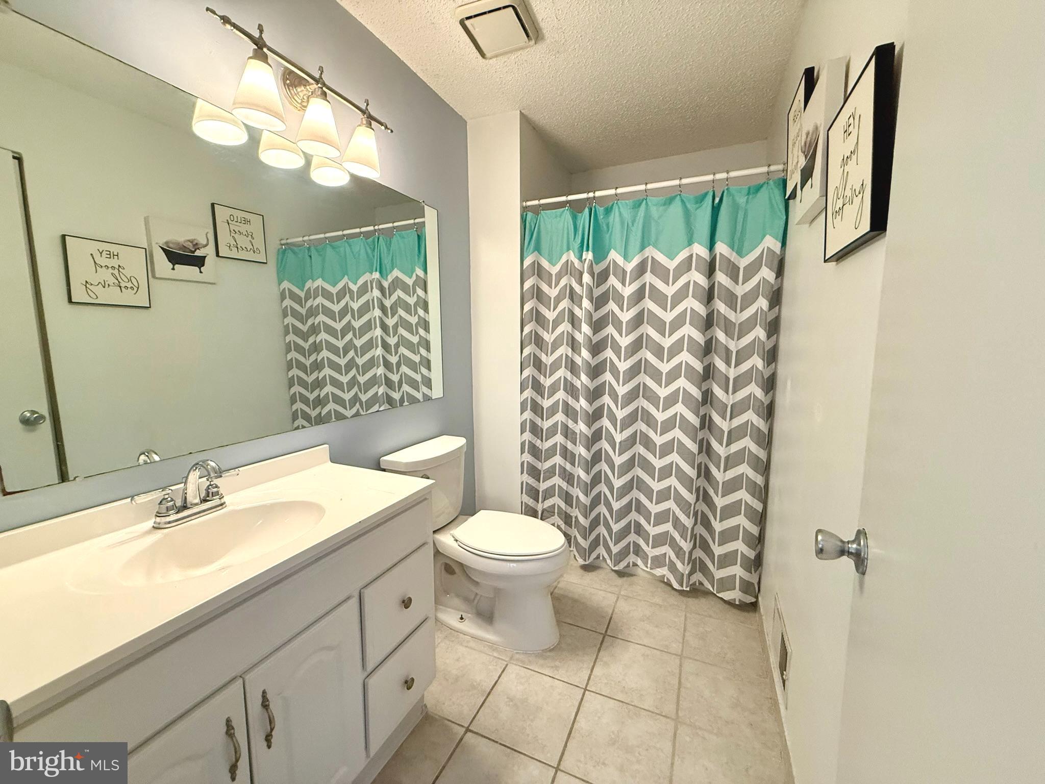 12 Juniper Way Hamilton, NJ 08619 - Photo 16 of 18 a bathroom with a sink toilet and shower