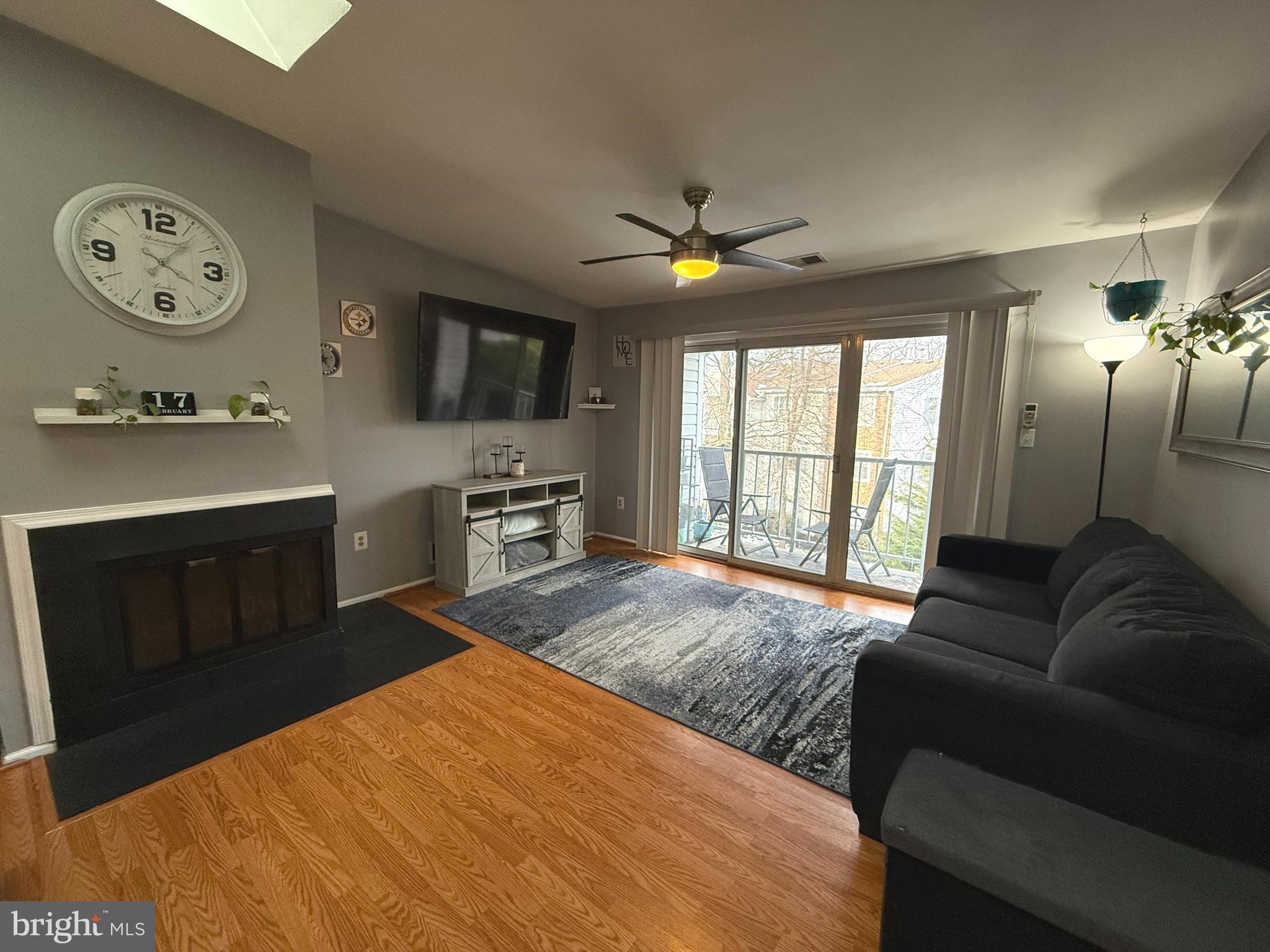 12 Juniper Way Hamilton, NJ 08619 - Photo 5 of 18 a living room with furniture a flat screen tv and a stove