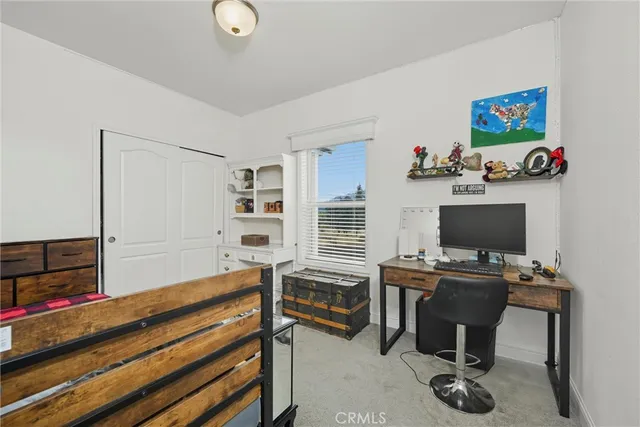 a workspace with furniture and window