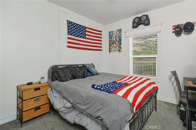 a bedroom with a bed and a closet