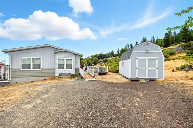 a view of a house with a snow in the yard