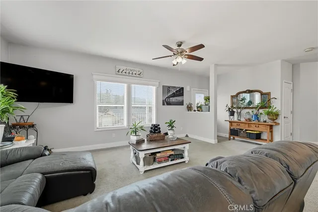 a bedroom with furniture and a flat screen tv
