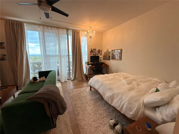 a bathroom with a toilet a sink and shower