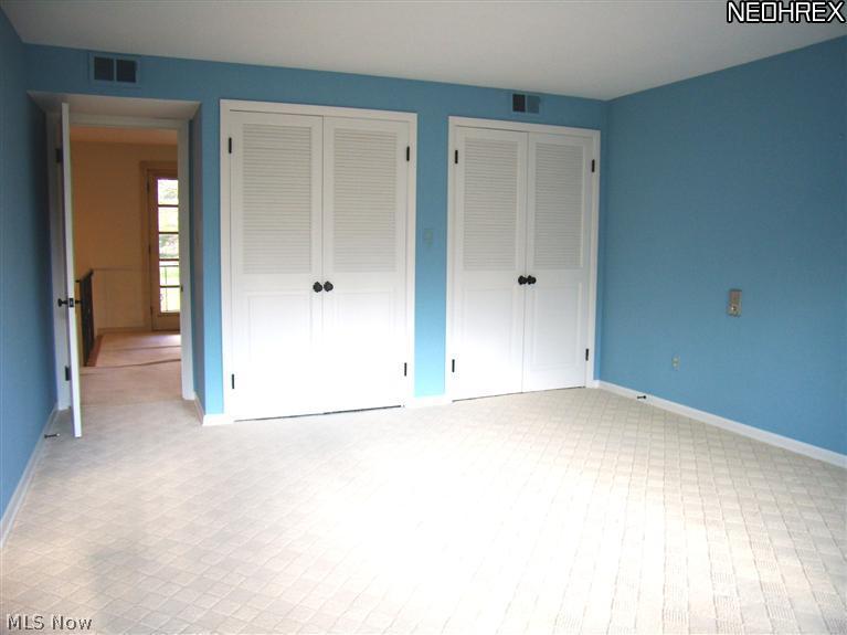 1630 County Line Road Gates Mills, OH 44040 - Photo 17 of 24 All bedrooms have generous closet space. This middle bedroom has two double closets. Note the wide upstairs hallway with font balcony access.