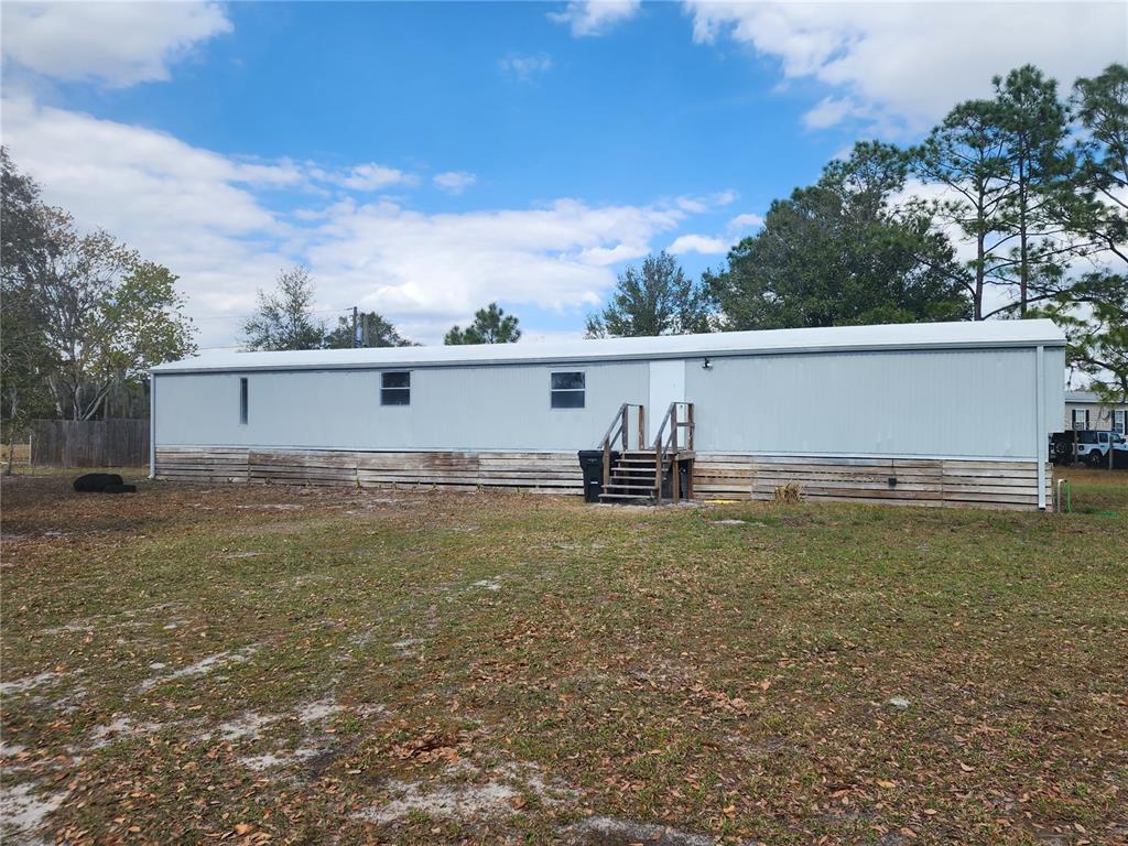 3114 Holly Hill Cutoff Road Davenport, FL 33837 - Photo 1 of 12 a view of outdoor space and yard