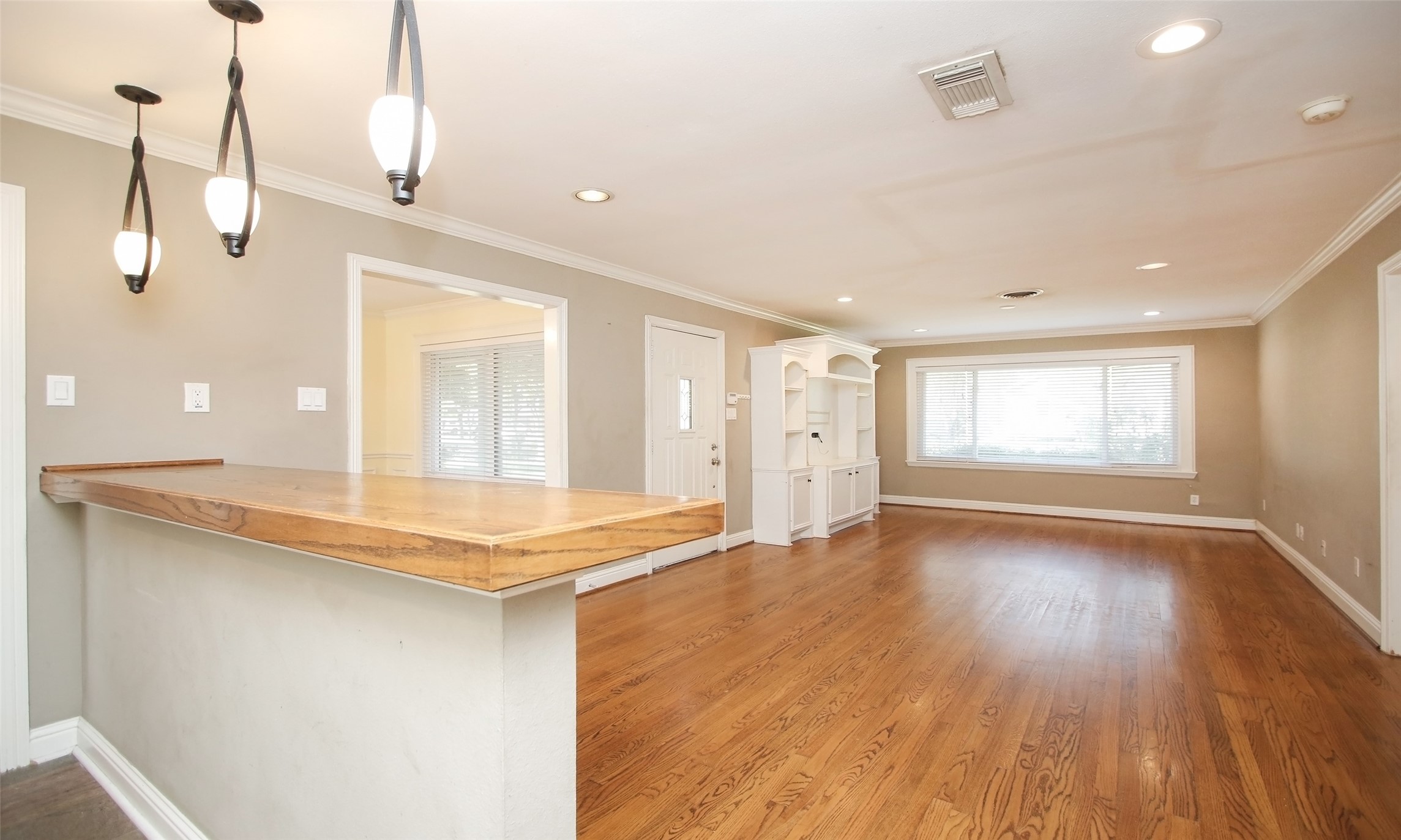 4809 Saxon Street Bellaire, TX 77401 - Photo 16 of 34 a view of a kitchen with a sink and wooden floor