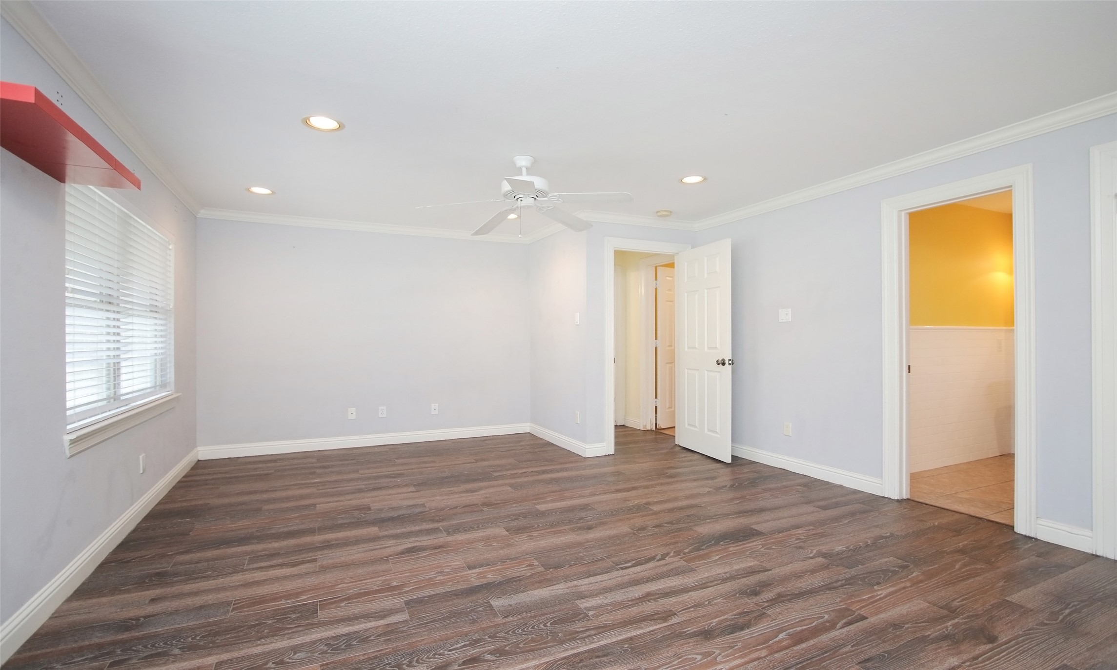 4809 Saxon Street Bellaire, TX 77401 - Photo 20 of 34 a view of an empty room with wooden floor and a window