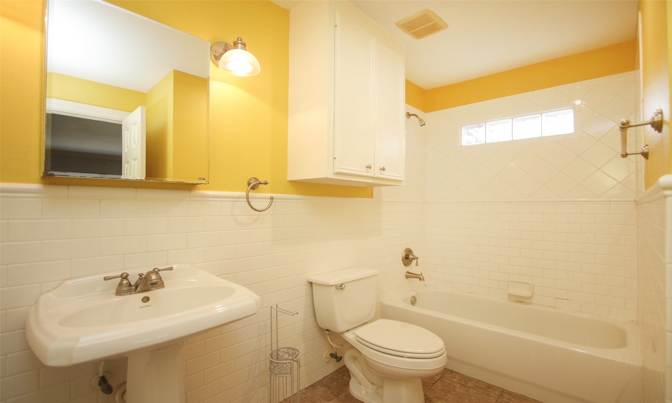 4809 Saxon Street Bellaire, TX 77401 - Photo 21 of 34 a bathroom with a sink toilet and shower