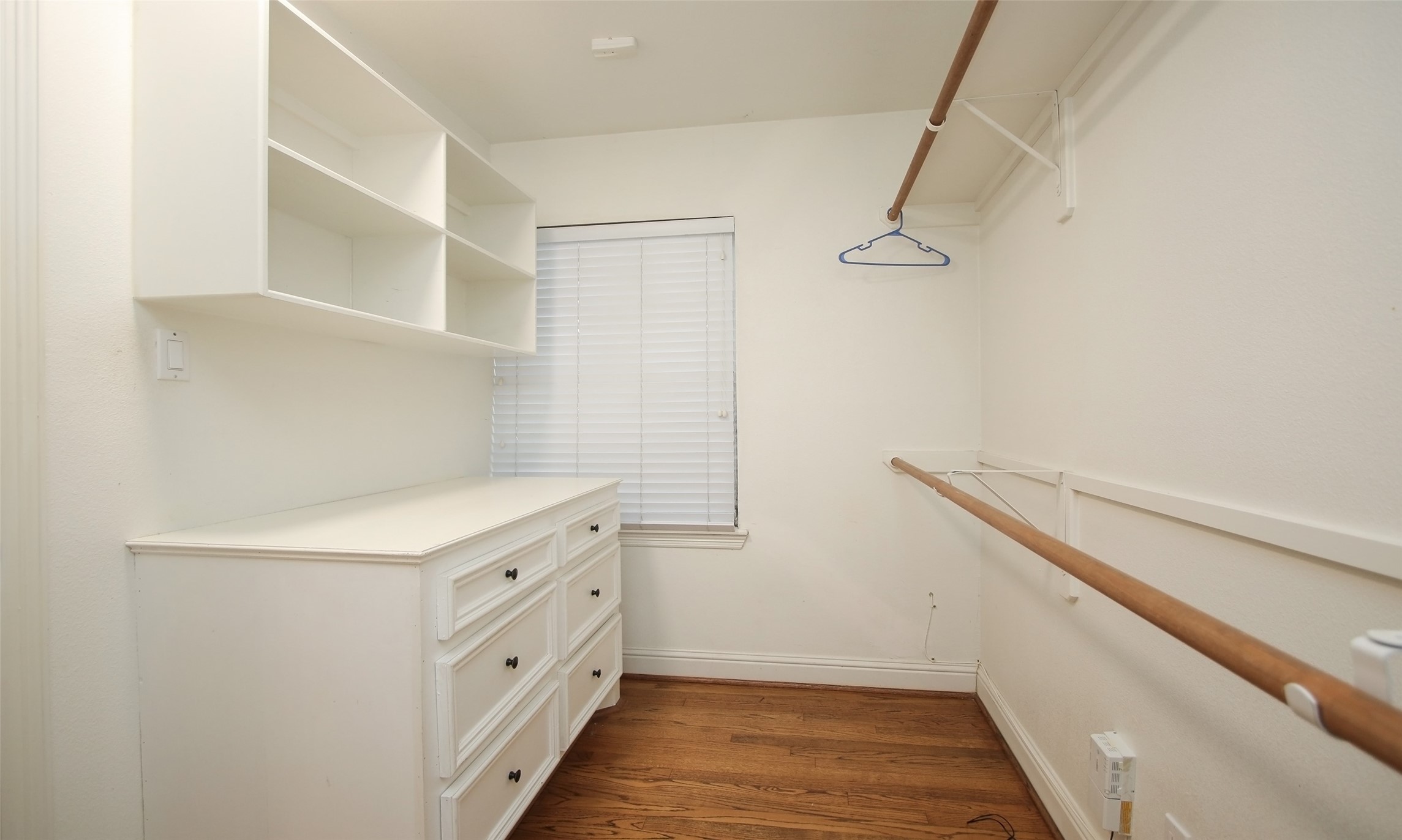 4809 Saxon Street Bellaire, TX 77401 - Photo 26 of 34 a kitchen with white cabinets and white appliances
