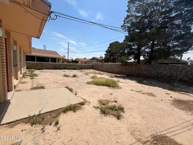 a view of a yard covered in snow