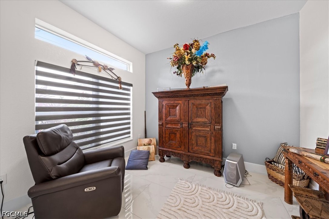22 Nelson Road South Cape Coral, FL 33991 - Photo 5 of 43 a living room with furniture and a window