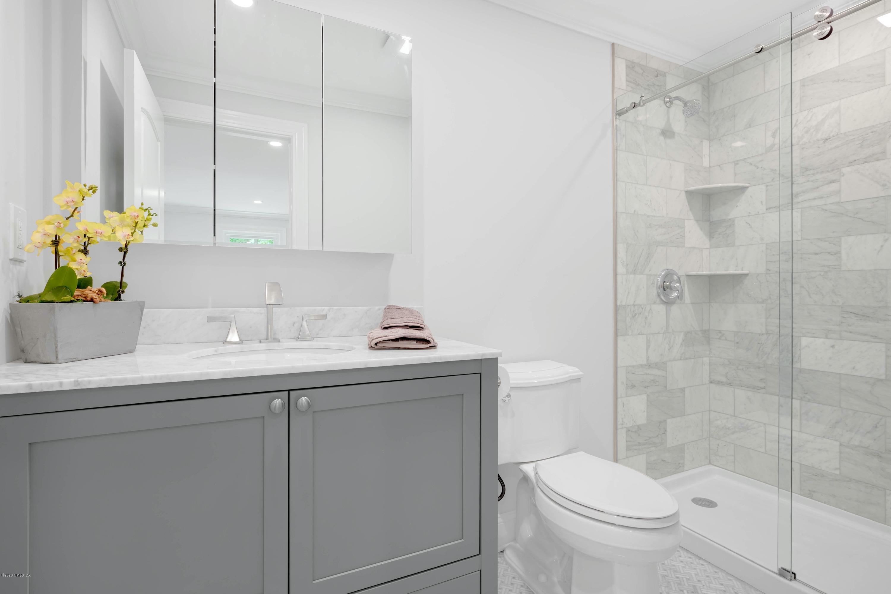 142 Old Mill Road Greenwich, CT 06831 - Photo 12 of 23 a bathroom with a sink toilet and shower