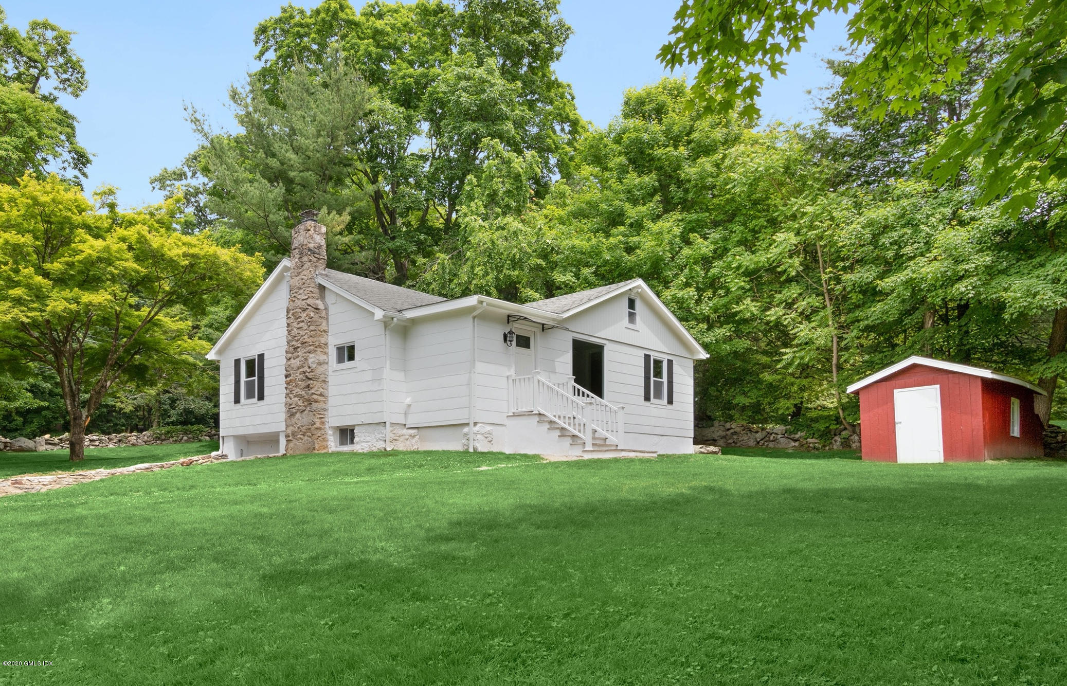 142 Old Mill Road Greenwich, CT 06831 - Photo 21 of 23 a house view with a garden