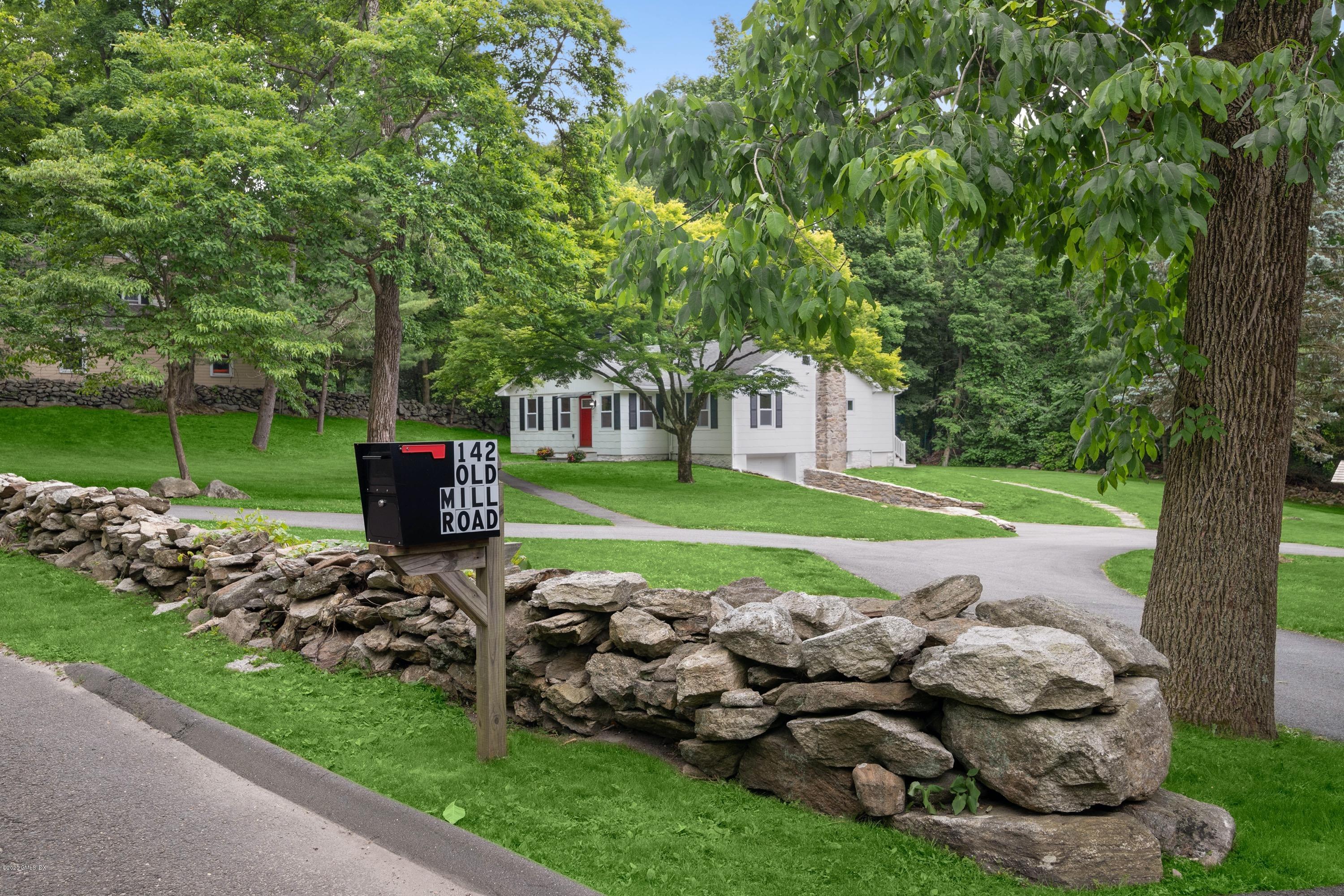 142 Old Mill Road Greenwich, CT 06831 - Photo 23 of 23 a front view of a house with garden