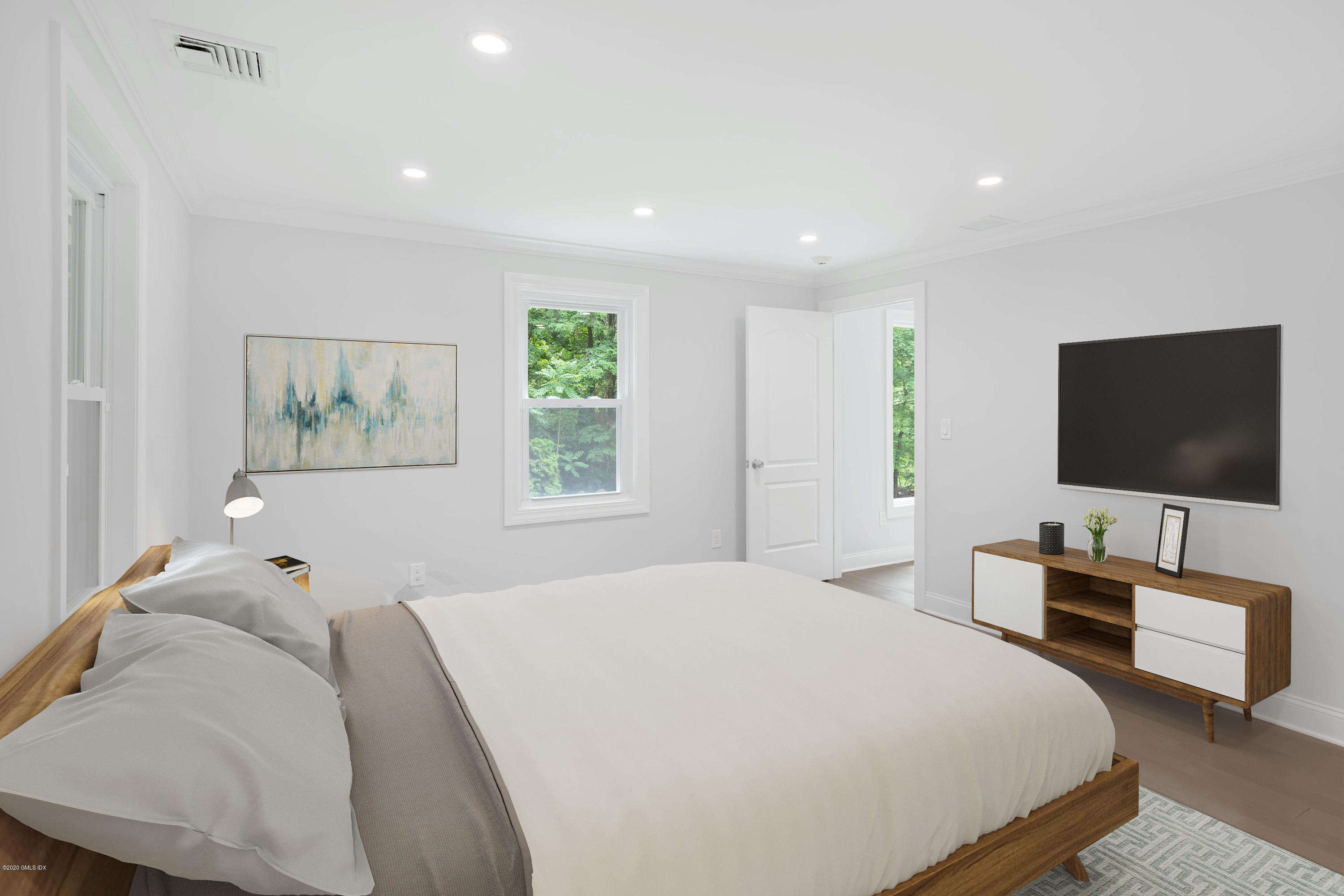 142 Old Mill Road Greenwich, CT 06831 - Photo 10 of 23 a bedroom with a bed and a flat screen television