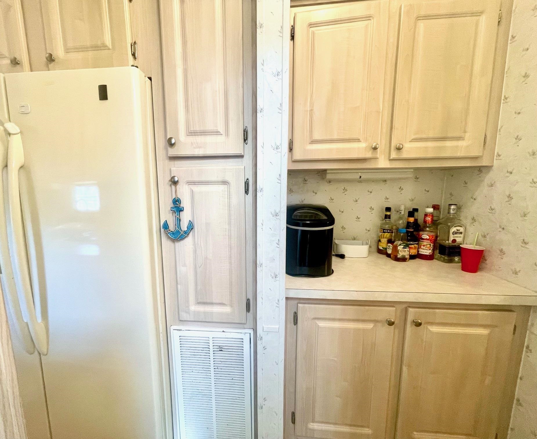 4100 Rte 9 South, Unit 56 Rio Grande, NJ 08242 - Photo 12 of 30 a kitchen with stainless steel appliances white cabinets and a refrigerator