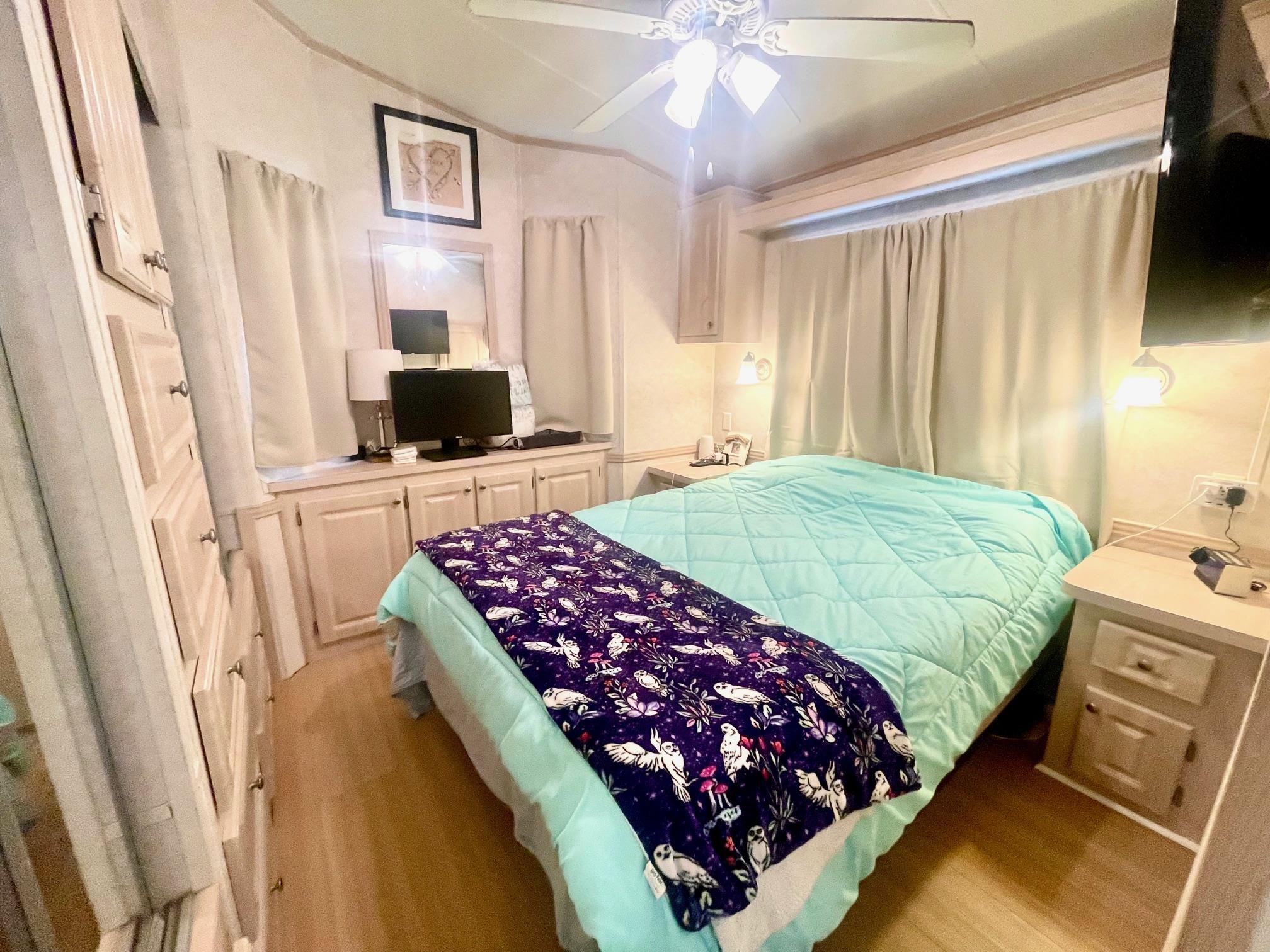 4100 Rte 9 South, Unit 56 Rio Grande, NJ 08242 - Photo 13 of 30 a bedroom with a bed and a flat screen tv