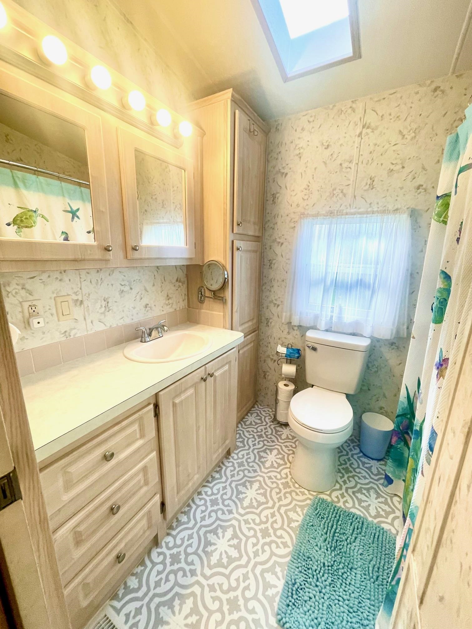 4100 Rte 9 South, Unit 56 Rio Grande, NJ 08242 - Photo 17 of 30 a bathroom with a sink toilet and shower