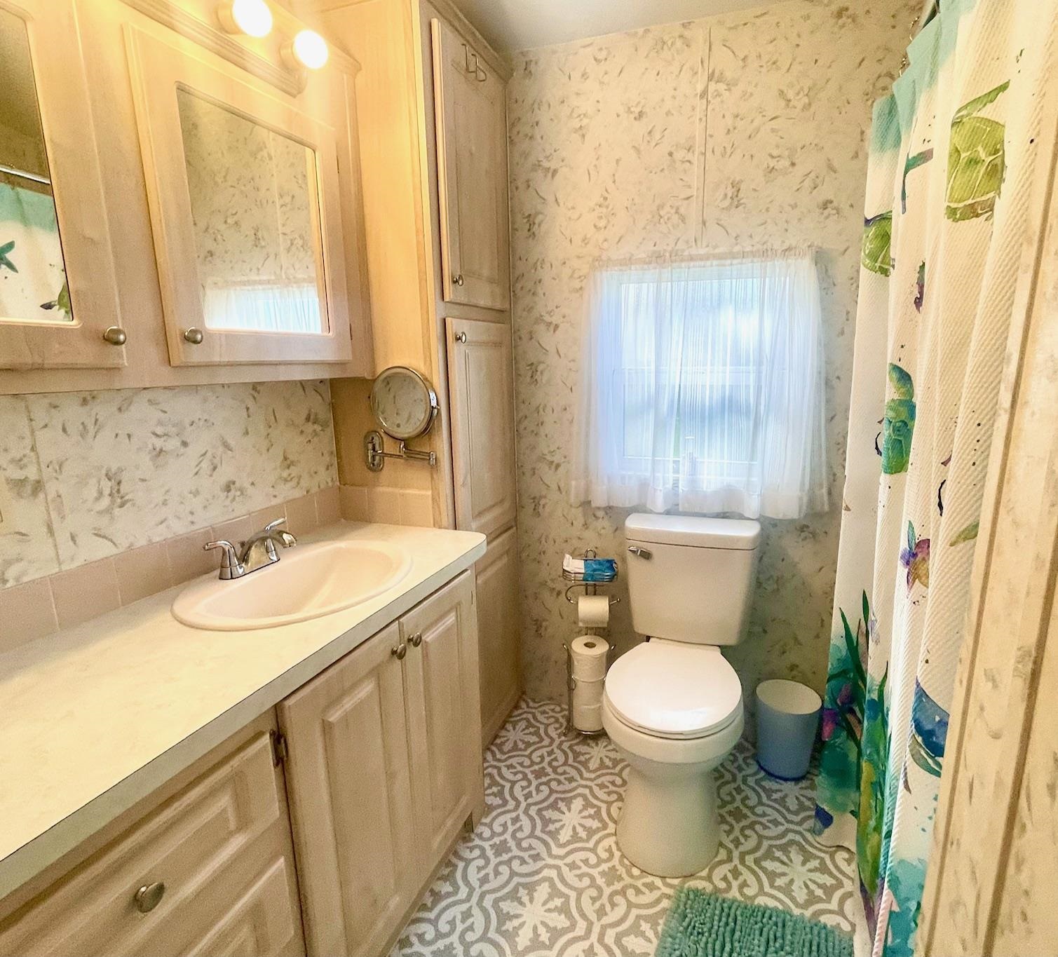 4100 Rte 9 South, Unit 56 Rio Grande, NJ 08242 - Photo 18 of 30 a bathroom with a sink toilet and shower