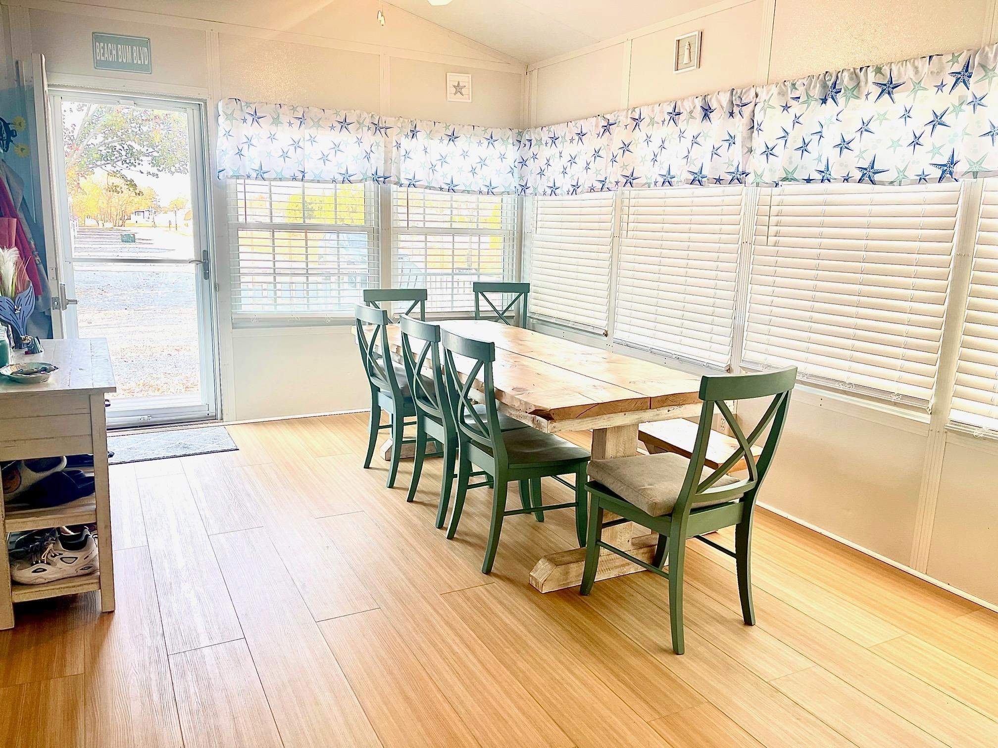 4100 Rte 9 South, Unit 56 Rio Grande, NJ 08242 - Photo 8 of 30 a dining room with furniture and wooden floor