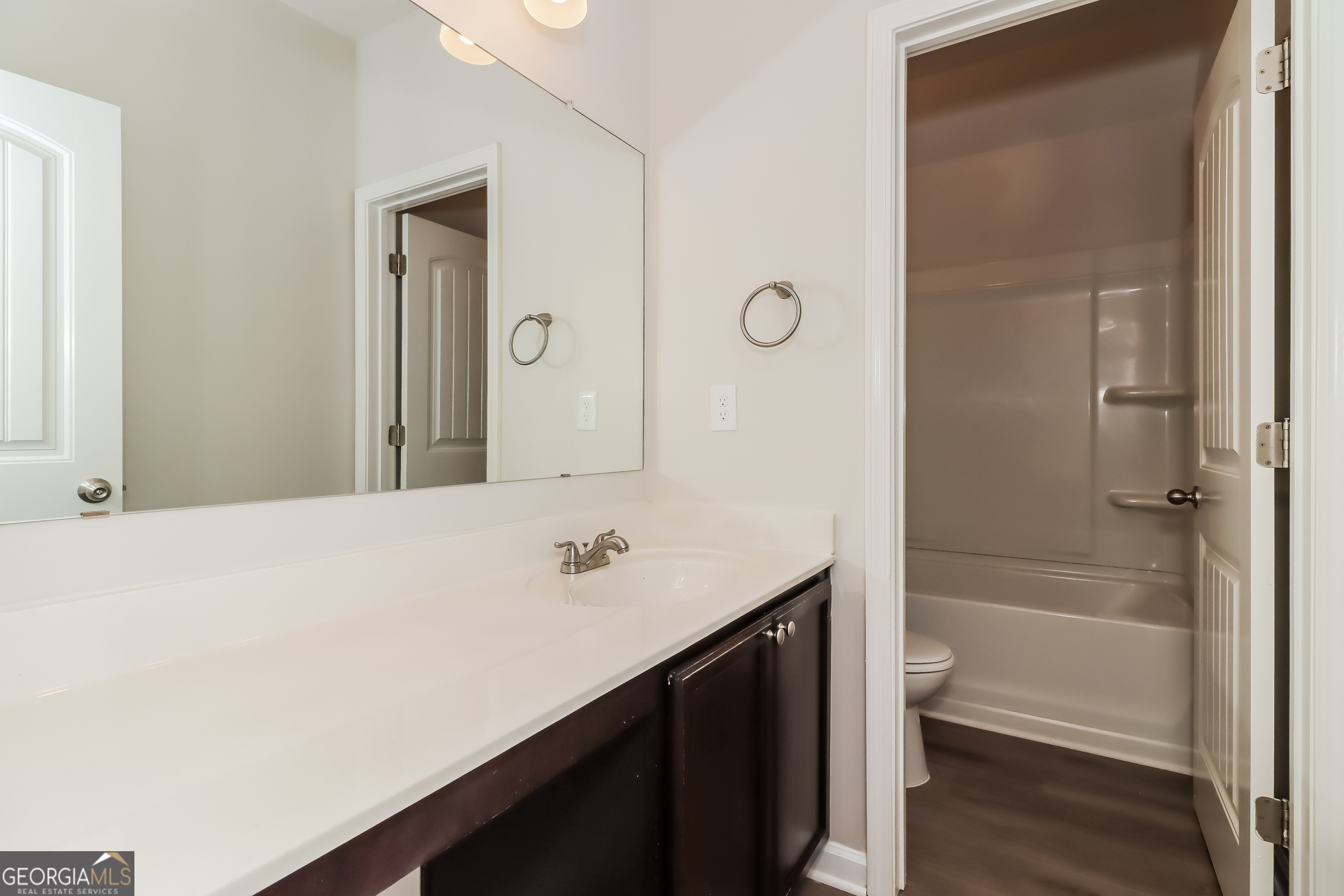 194 Randy Way Dallas, GA 30132 - Photo 14 of 17 a bathroom with a sink a toilet and shower