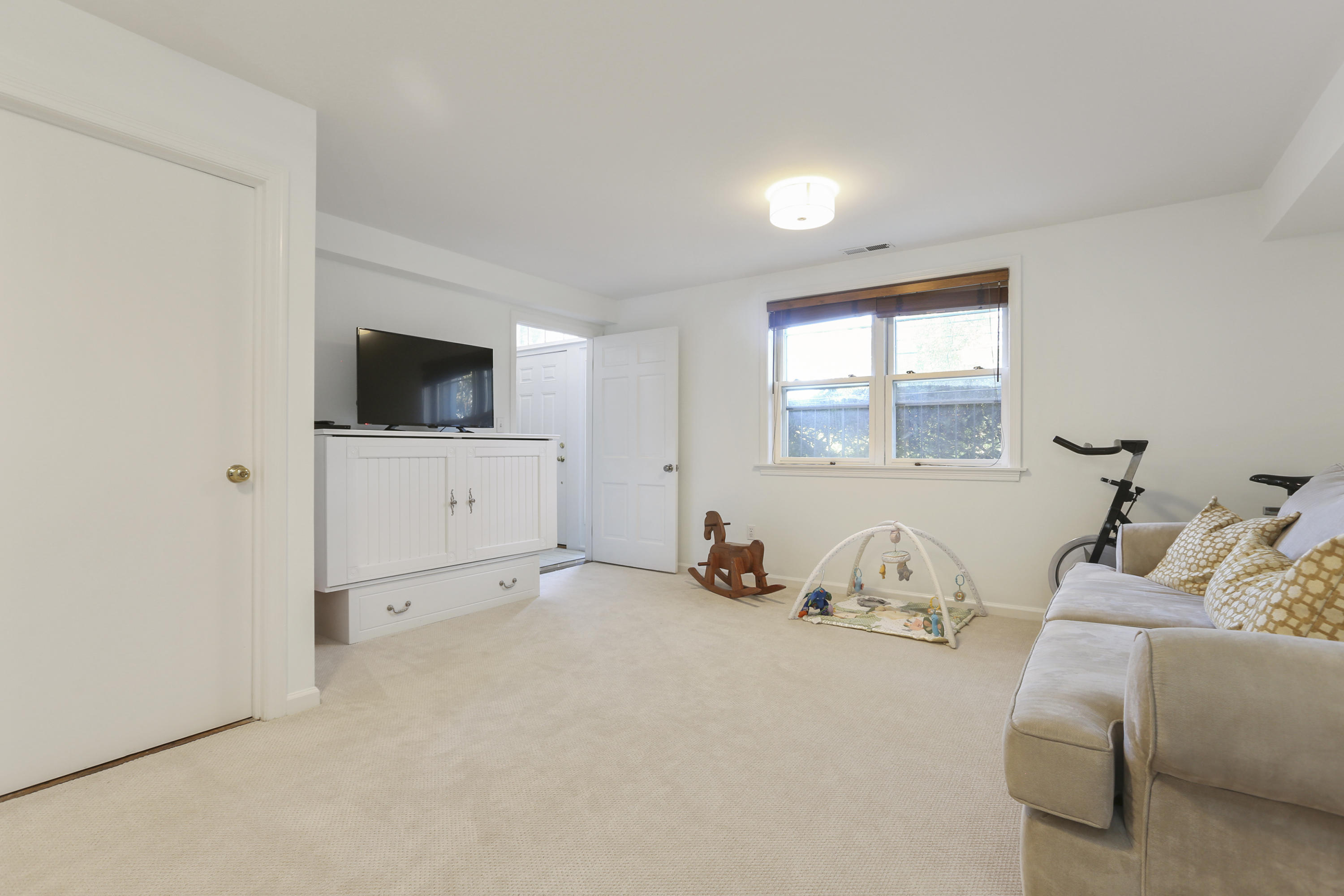 91 Gardiner Street Darien, CT 06820 - Photo 26 of 33 a living room with furniture and a flat screen tv