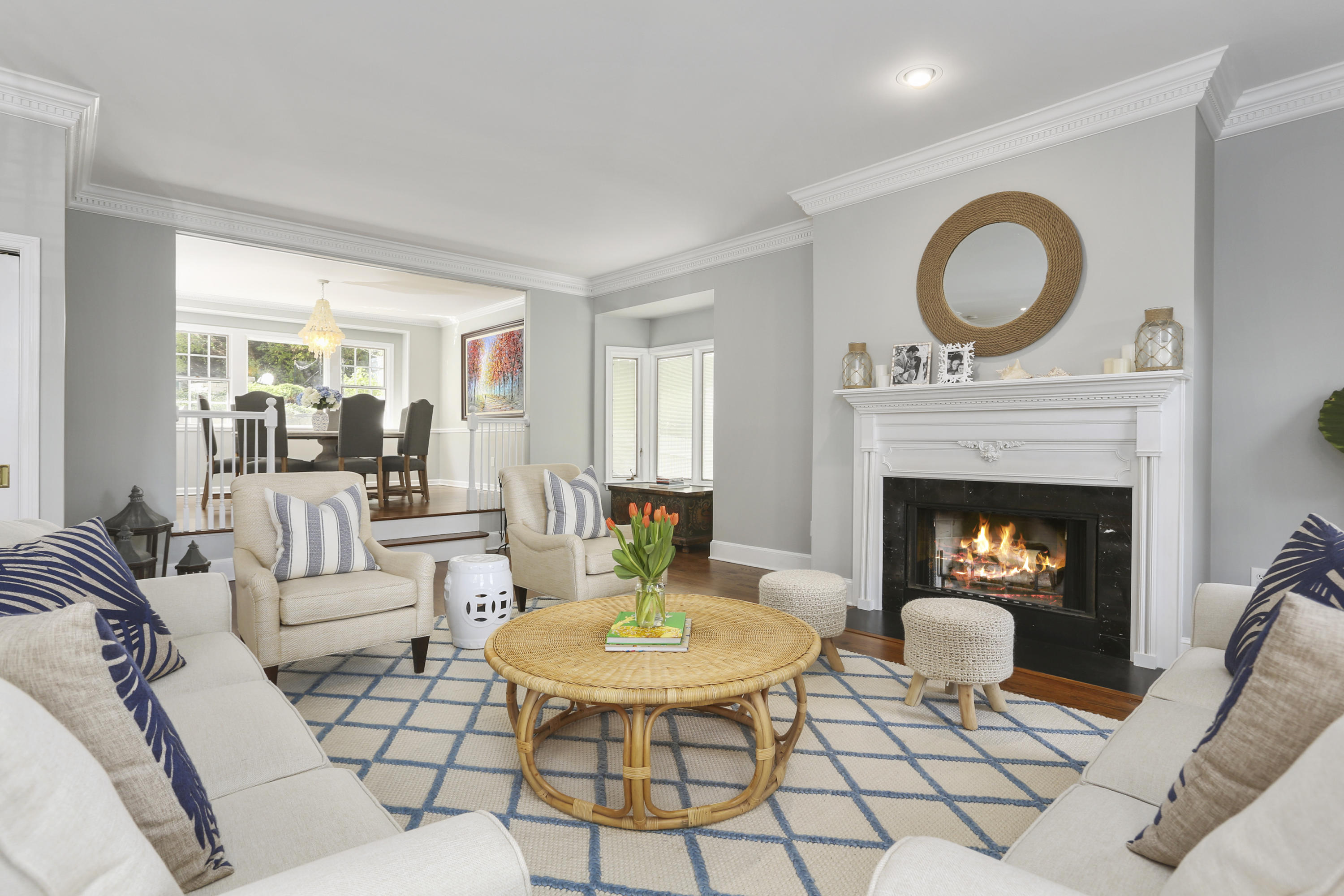 91 Gardiner Street Darien, CT 06820 - Photo 5 of 33 a living room with furniture a rug a fireplace and a large window