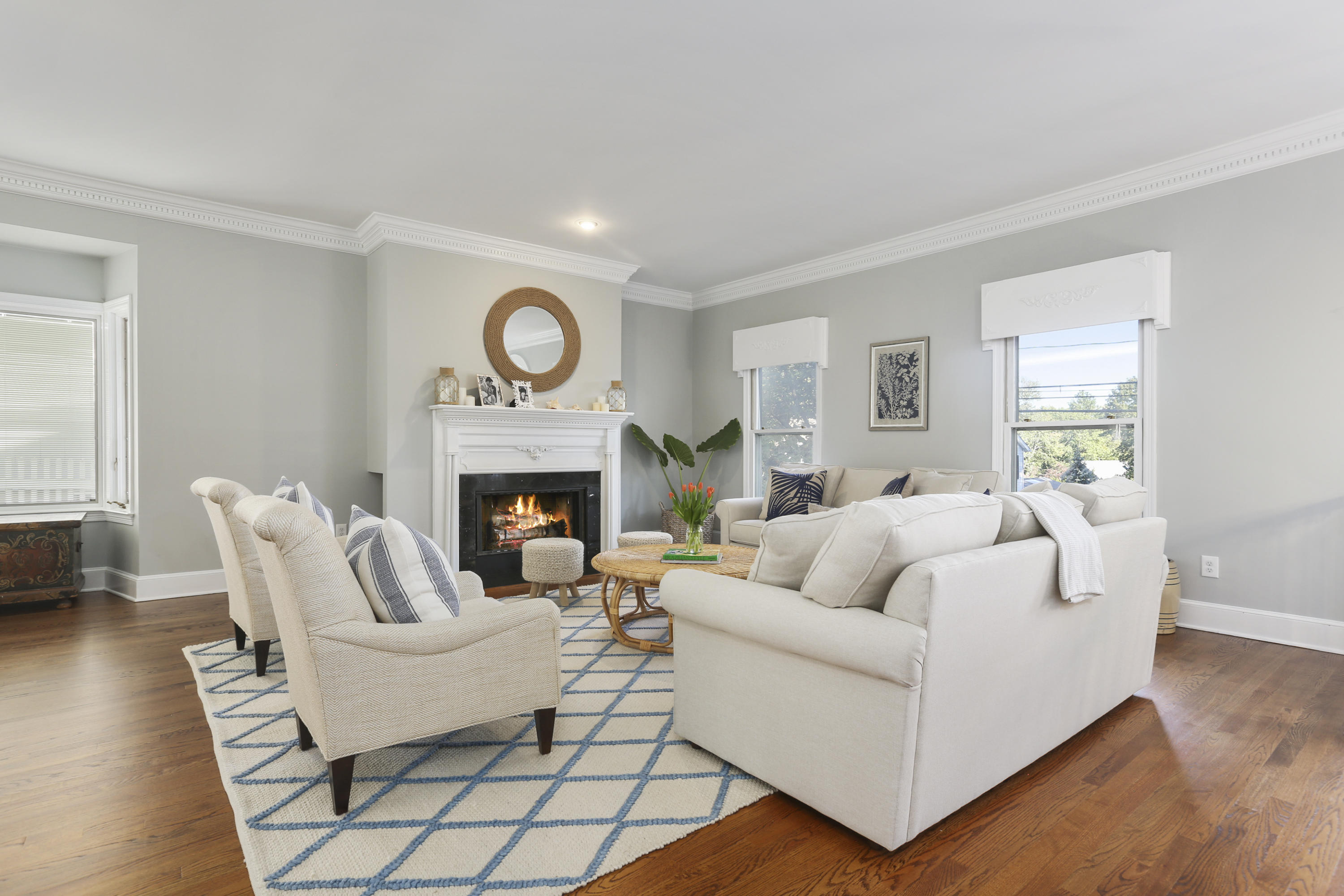 91 Gardiner Street Darien, CT 06820 - Photo 6 of 33 a living room with furniture a fireplace and a table