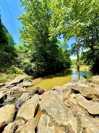 a view of swimming pool with a yard