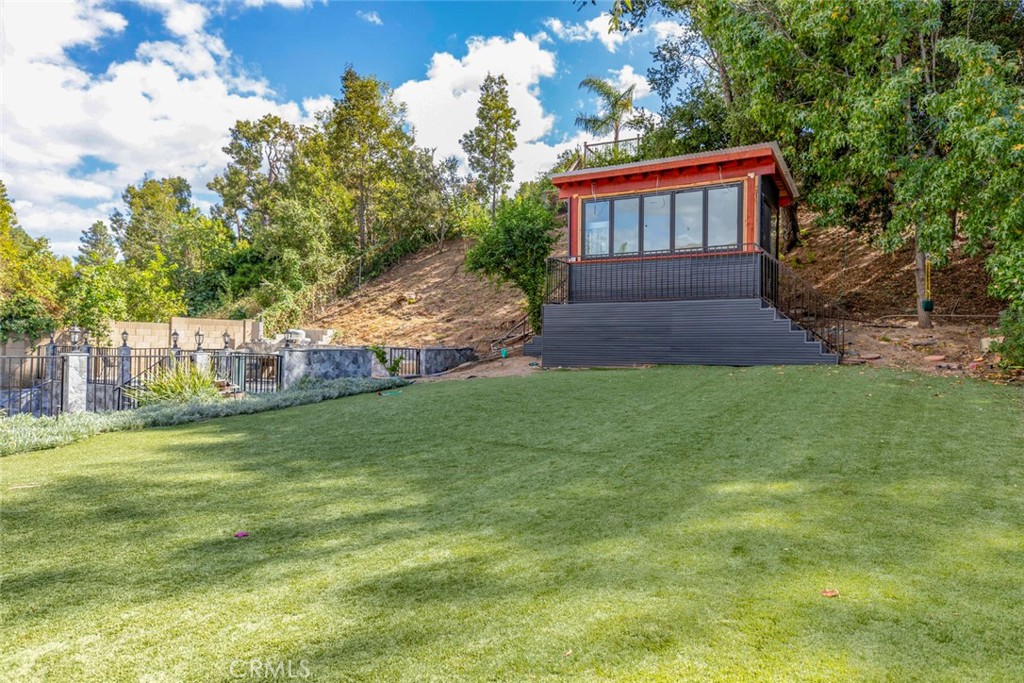 18810 Kirkcolm Lane Porter Ranch, CA 91326 - Photo 32 of 75 a view of backyard with garden and trees
