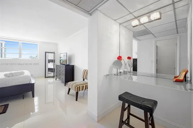 a bedroom with furniture and a chandelier