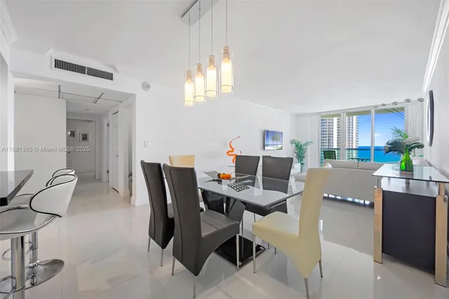 a workspace with furniture and a chandelier