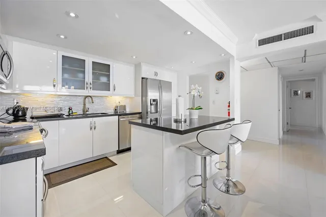a kitchen with counter top space and appliances